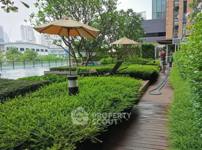 Luxurious rooftop garden with pool and city view, perfect for relaxation and leisure in urban living.