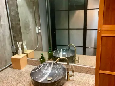 Modern bathroom with stylish marble sink and elegant fixtures