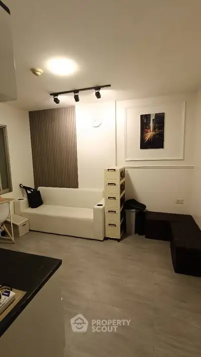 Modern living room with minimalist decor and stylish lighting