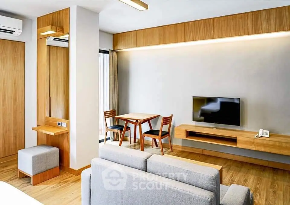 Modern living room with wooden furniture and sleek design
