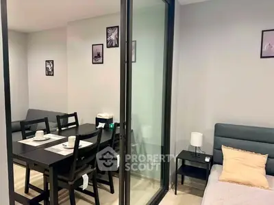 Modern apartment interior with dining area and cozy bedroom