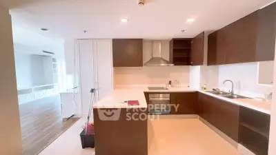 Modern kitchen with sleek cabinetry and open layout in a spacious apartment
