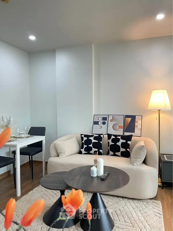 Stylish modern living room with cozy sofa, chic decor, and elegant lighting, perfect for relaxation and entertaining.