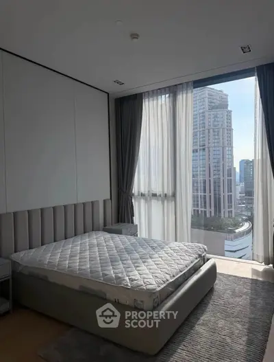 Luxurious bedroom with stunning city view and modern decor