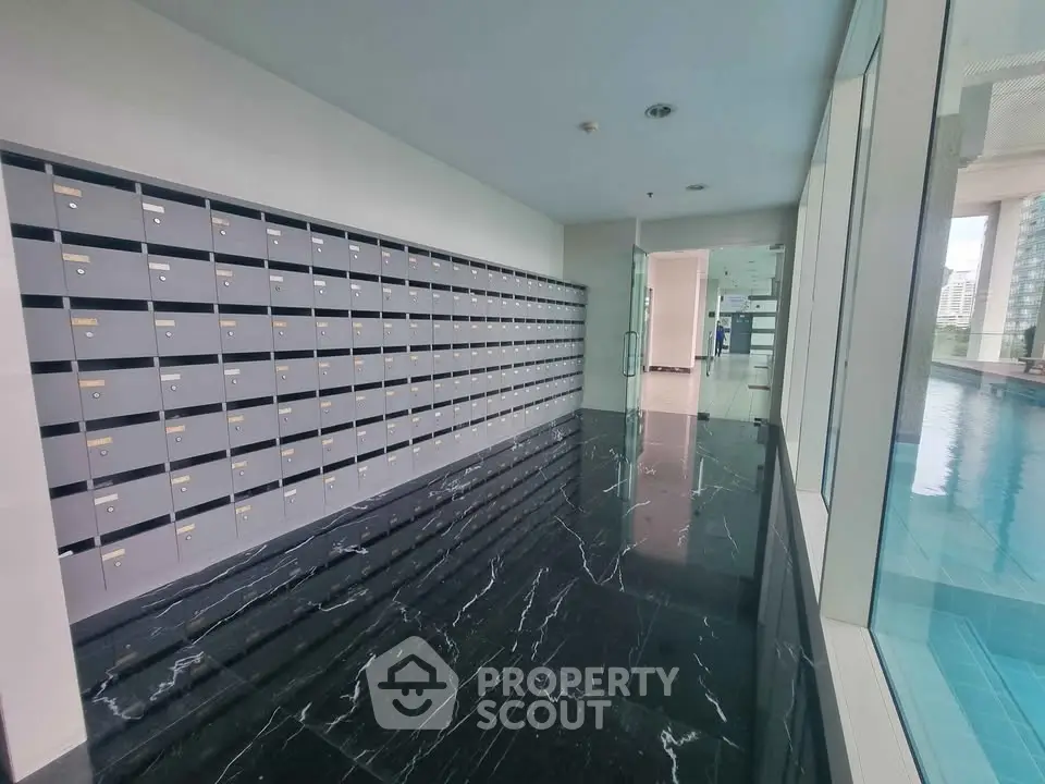 Modern apartment building with sleek mailboxes and polished marble flooring