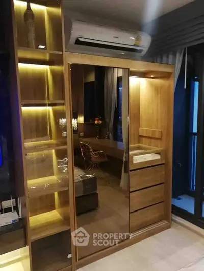 Modern bedroom with stylish wooden wardrobe and ambient lighting