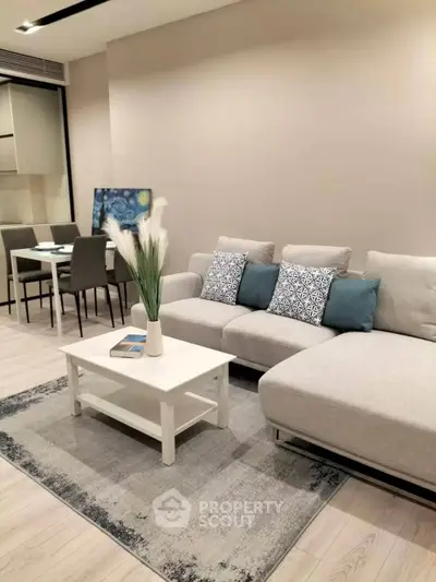 Modern living room with stylish decor and comfortable seating in a contemporary apartment.