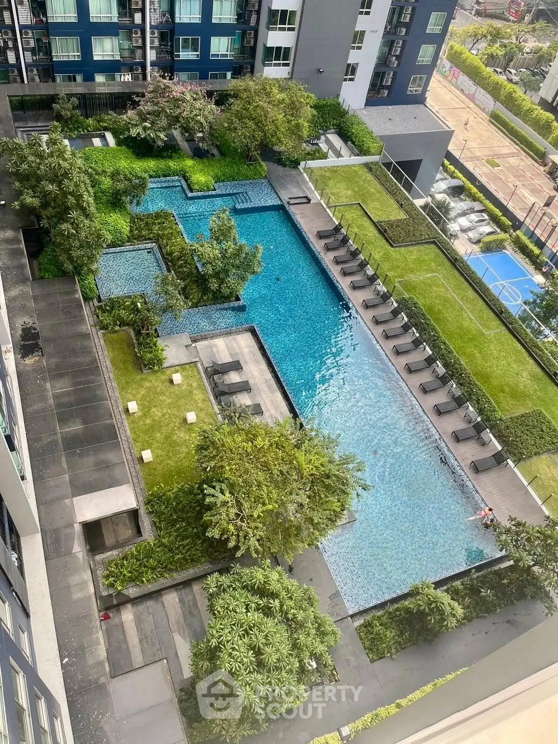 Luxurious condominium with stunning rooftop pool and lush garden views, perfect for relaxation and leisure.