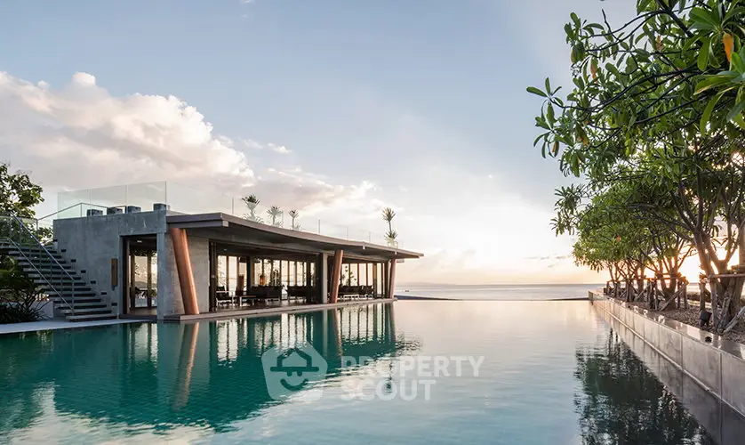 Luxurious beachfront property with stunning infinity pool and modern architecture.