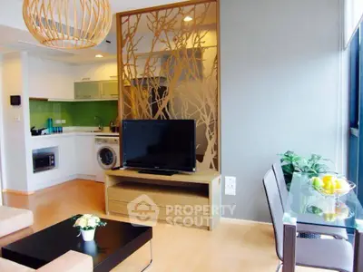 Modern living room with open kitchen and stylish decor