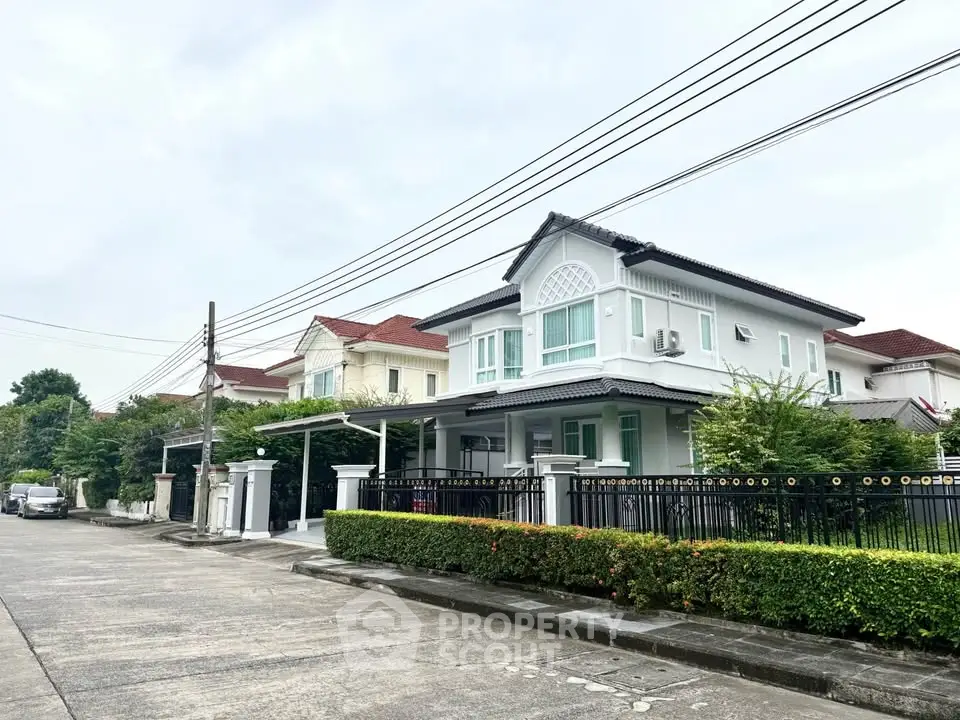 Charming suburban house with modern design and lush greenery, perfect for family living.