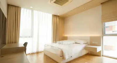Modern bedroom with natural light and minimalist design