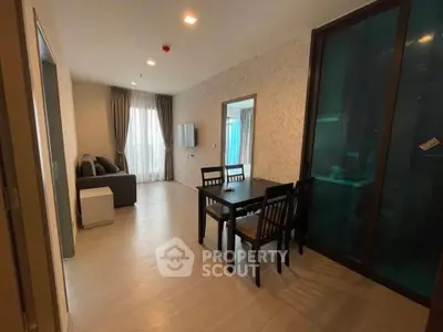 Modern living room with dining area and large window in stylish apartment