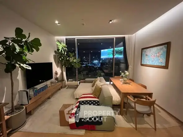 Stylish living room with city view, modern furniture, and cozy ambiance.