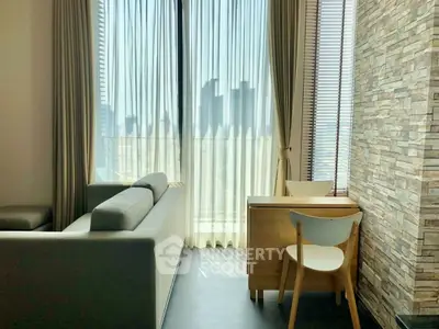 Modern living room with stylish furniture and city view through large windows.