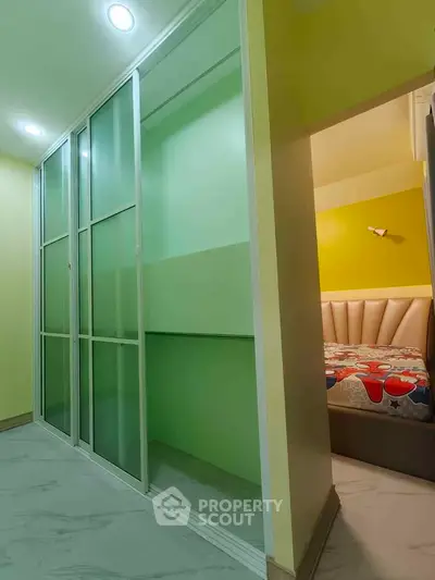 Modern bedroom with sliding glass closet doors and stylish bed design