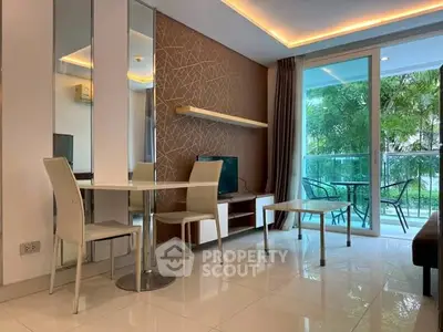 Modern living room with sleek furniture and balcony view