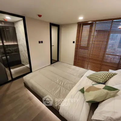 Modern bedroom with minimalist design and wooden accents