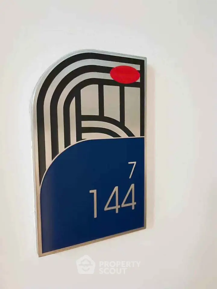 Modern apartment number sign with sleek design and bold colors
