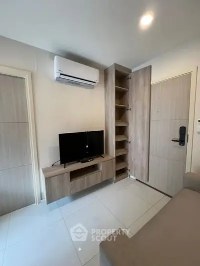 Modern living room with sleek TV unit and air conditioning