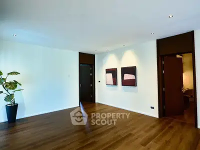 Spacious modern living room with wooden flooring and stylish decor