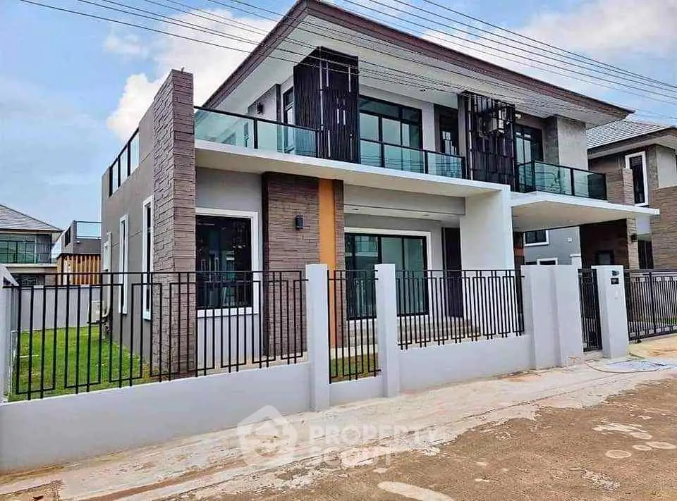 Modern two-story house with sleek design and spacious balcony