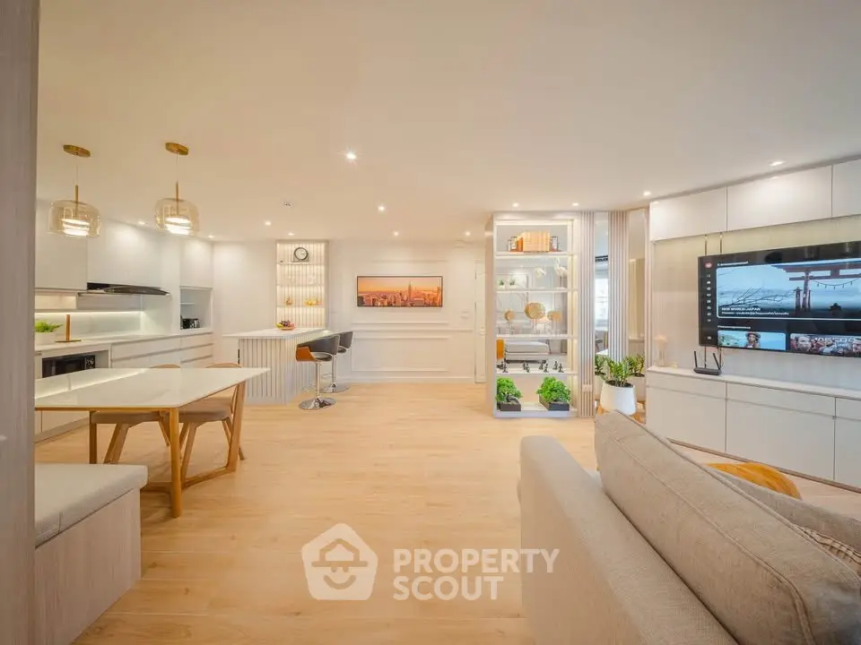 Spacious modern living room with open kitchen and elegant decor