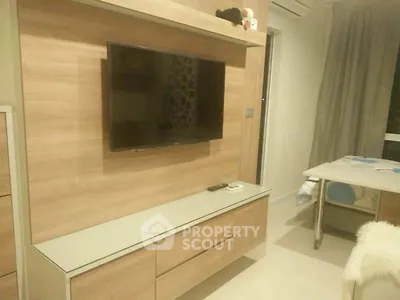 Modern living room with sleek TV unit and cozy decor