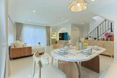 Spacious modern living room with elegant dining area and stylish decor