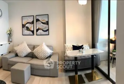 Modern living room with stylish decor and large windows offering natural light