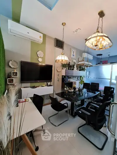 Modern office space with stylish decor and ample seating in a bright, contemporary setting.