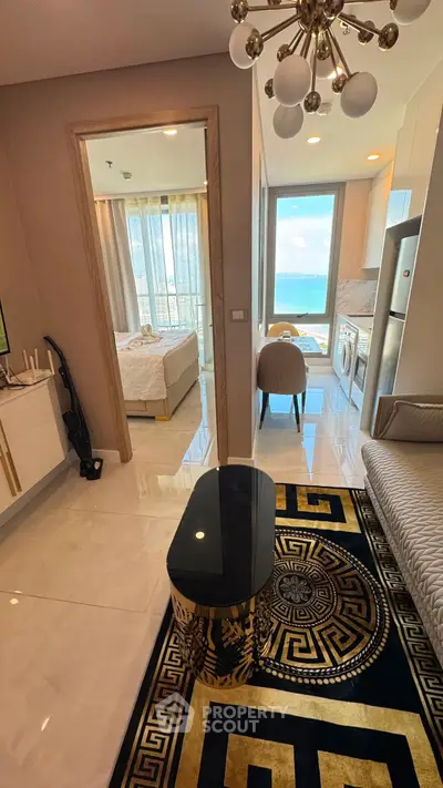 Luxurious apartment interior with modern decor and stunning sea view from the bedroom and living area.