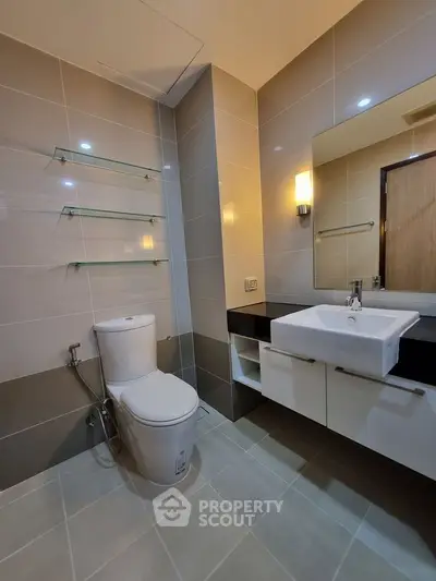 Modern bathroom with sleek fixtures and elegant lighting