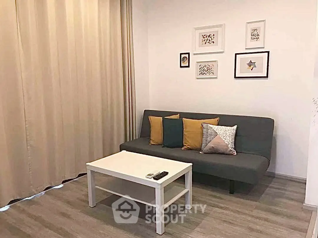Cozy living room with modern sofa and stylish decor, perfect for relaxation.