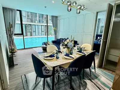 Luxurious dining area with pool view in modern apartment