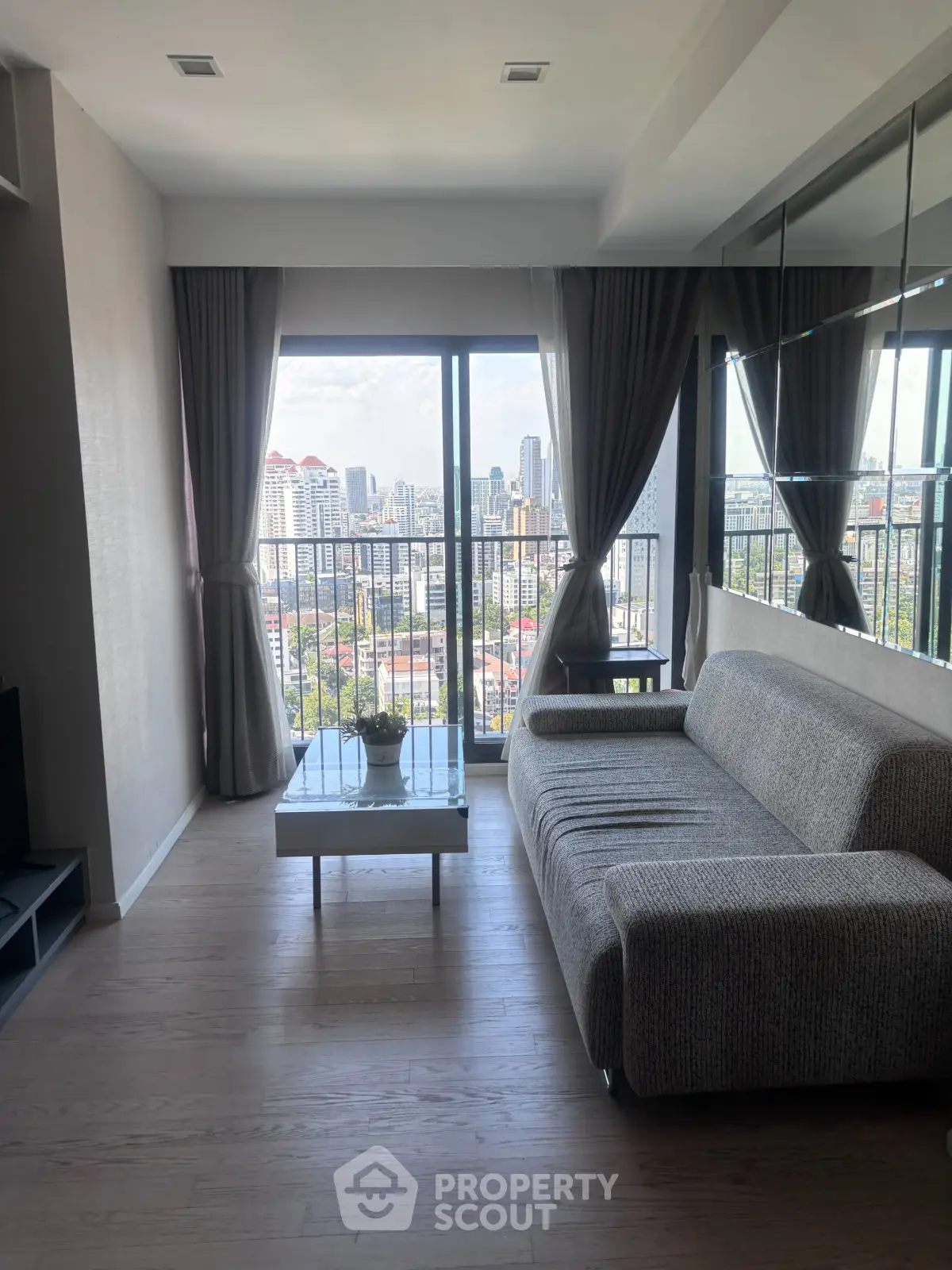 Modern living room with city view and stylish decor