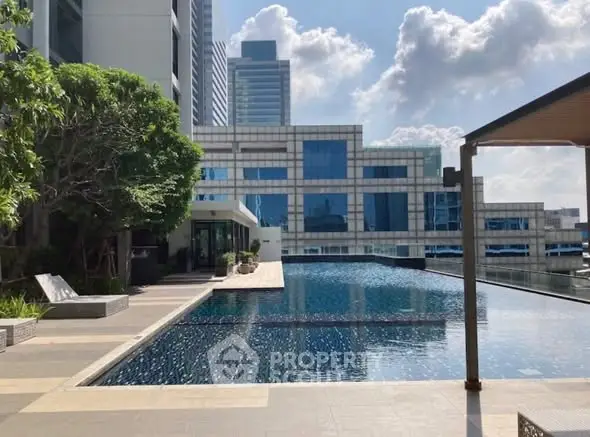 Luxurious rooftop pool with stunning cityscape views and modern architecture.