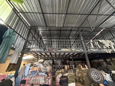 Spacious industrial warehouse with mezzanine and ample storage space