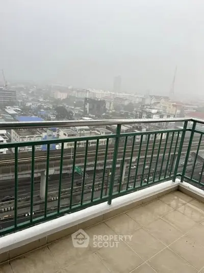 Spacious balcony with city view, perfect for urban living enthusiasts.
