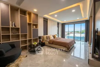 Luxurious modern bedroom with spacious layout and large windows offering stunning views.