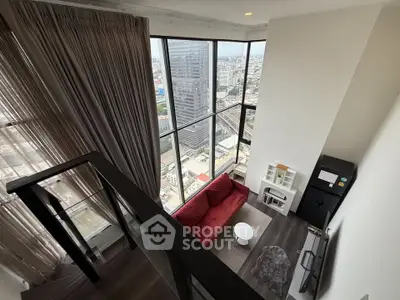 Stunning high-rise living room with floor-to-ceiling windows and city view.