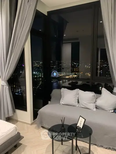 Luxurious living room with stunning night city view and elegant decor