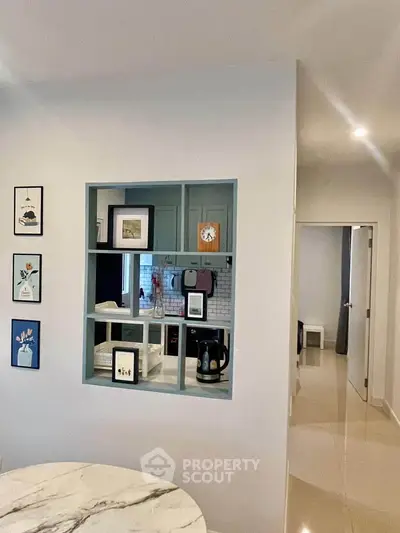 Modern kitchen with open layout and stylish decor in a cozy apartment.