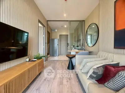 Modern living room with stylish decor and open kitchen layout