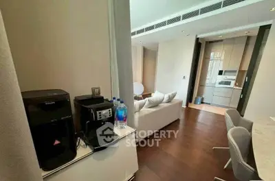 Modern open-plan living room with sleek kitchen and cozy seating area