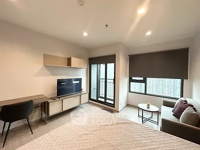 Modern bedroom with balcony and stylish furniture in urban apartment