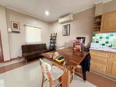 Charming living room with modern decor and open kitchen layout