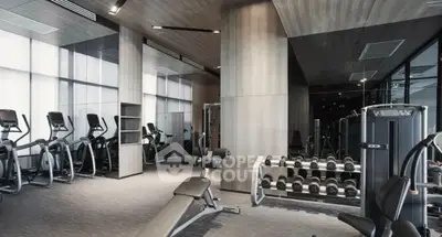 Modern gym with state-of-the-art equipment in luxury real estate property.