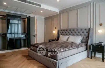 Luxurious bedroom with plush bed and elegant decor in modern apartment