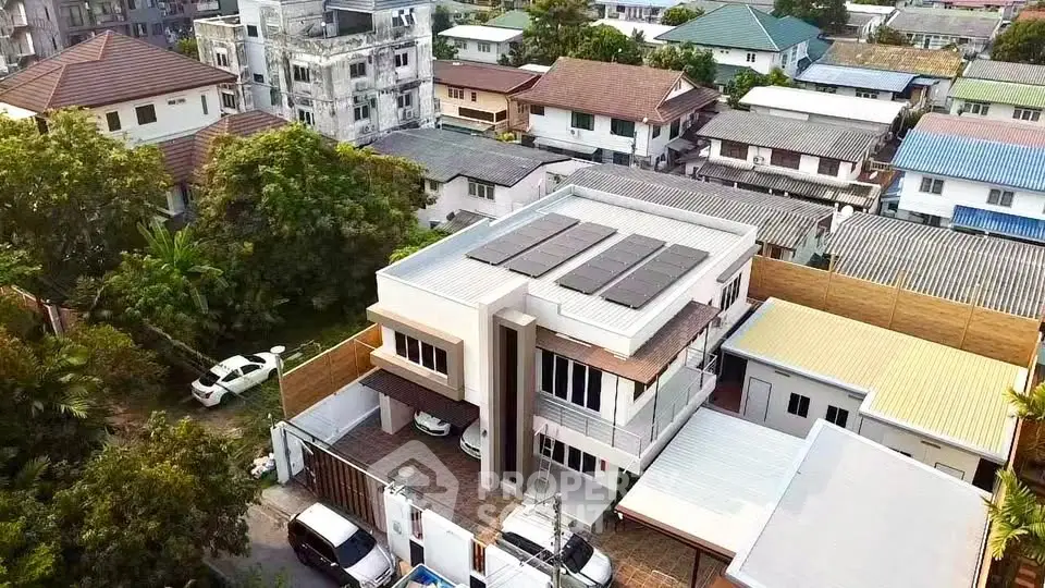 Modern two-story house with solar panels in a suburban neighborhood